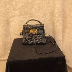 Black Mini Carry Handbag with removable Shoulder strap.